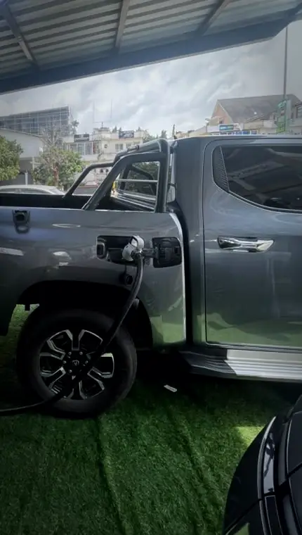 An electric pickup plugged into an EV Hub NG charger